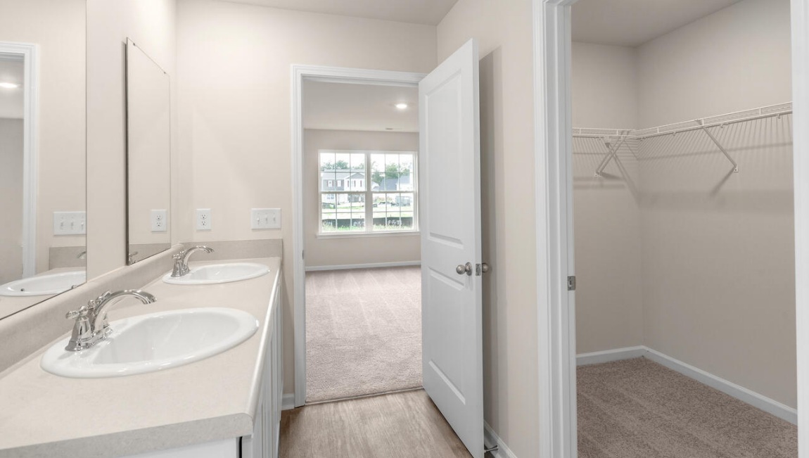Need privacy? The primary suite is tucked away in the back of the home, offering a peaceful retreat complete with a walk-in shower, granite vanity, and a roomy walk-in closet. Three additional bedrooms are located up front- perfect for guests, kids, or a home office setup.  And don't forge