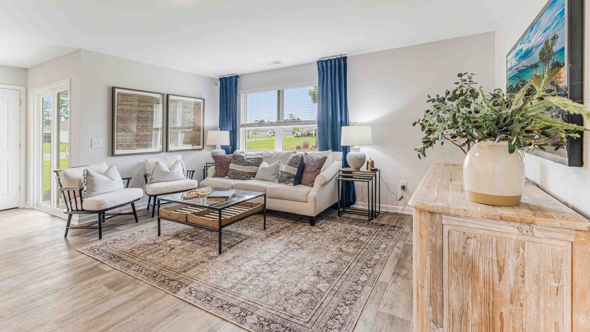 The open-concept family room, kitchen, and dining area feature Granite countertops, stainless steel appliances, including a smooth-top range, dishwasher and overhead microwave