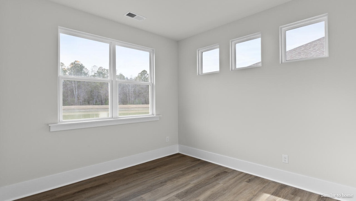 Durable luxury vinyl plank flooring runs throughout the first floor, designed to handle your beach days year-round.