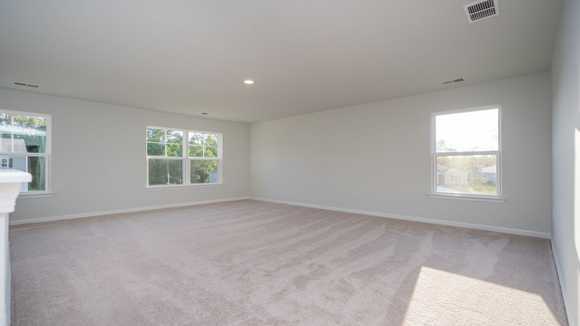 Featuring a first floor primary bedroom with generous bath and walk-in closet.