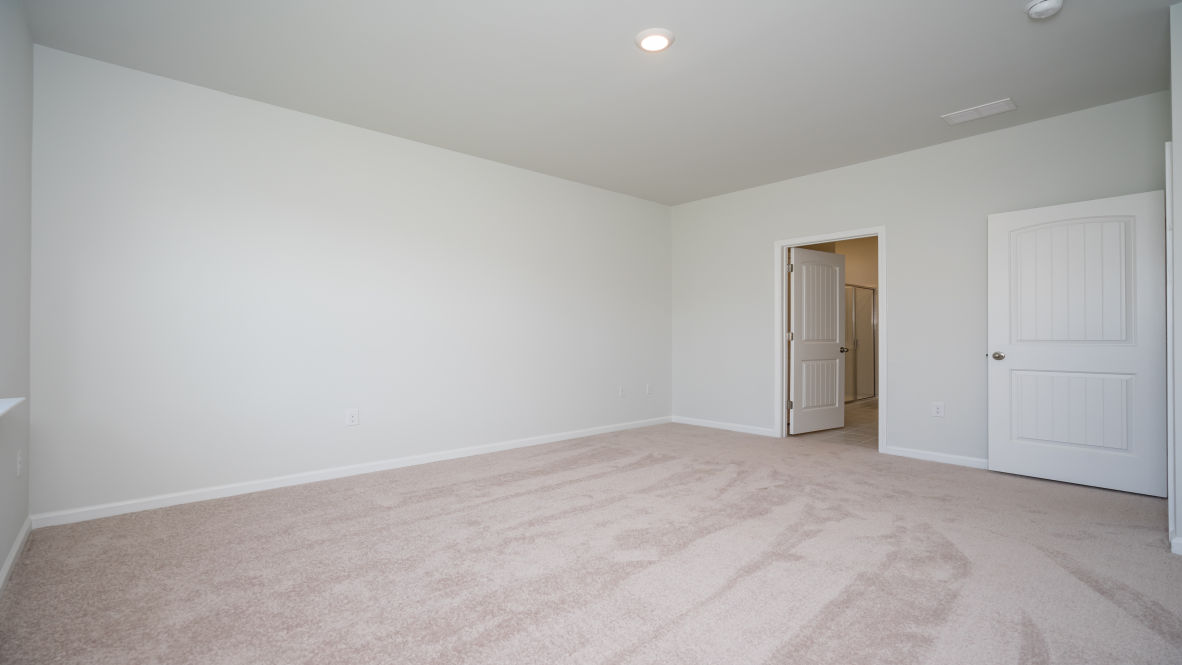 Featuring a first floor primary bedroom with generous bath and walk-in closet.