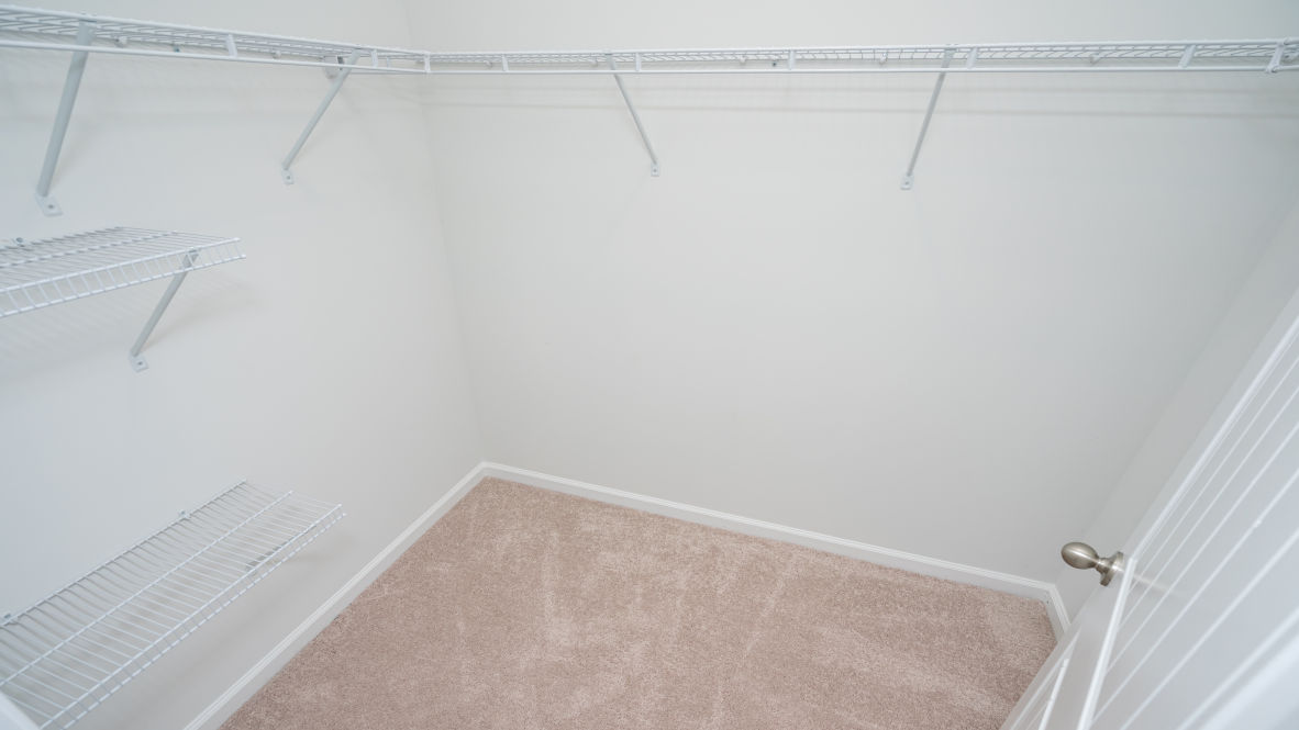 Featuring a first floor primary bedroom with generous bath and walk-in closet.