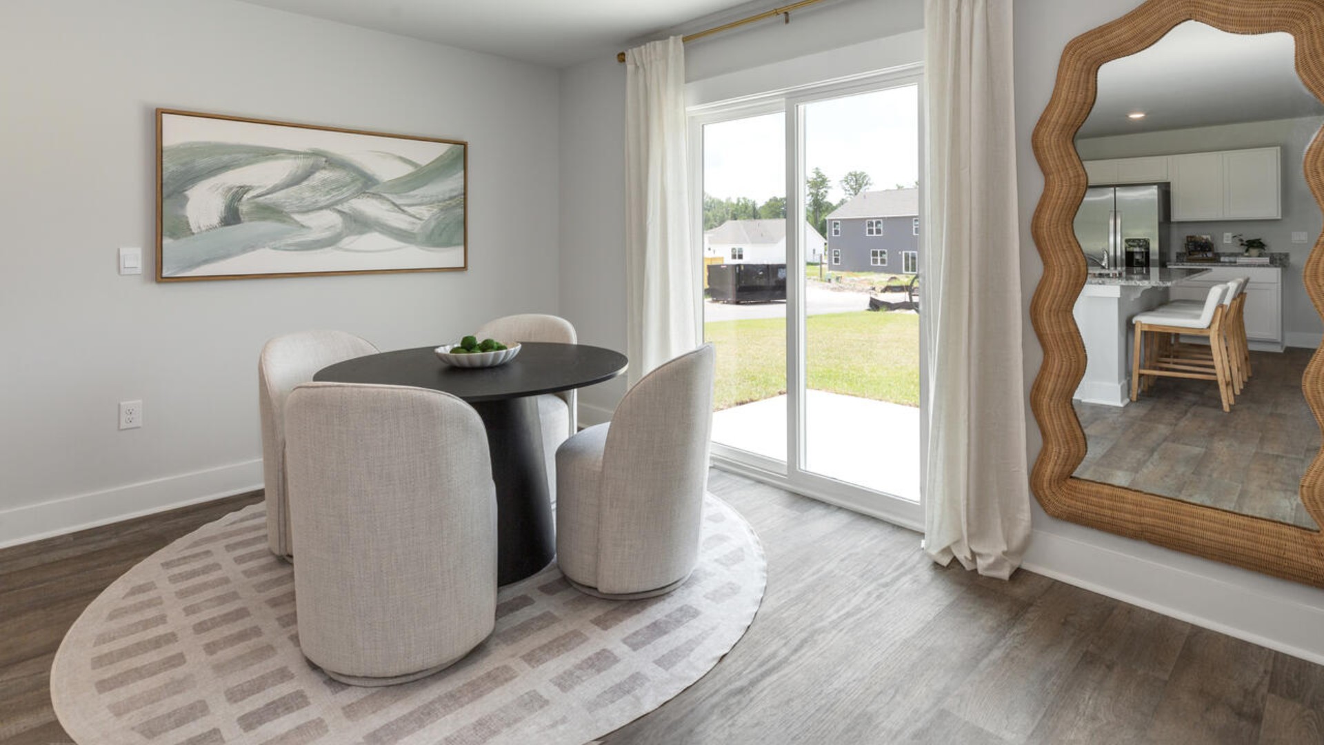 The open-concept kitchen features granite countertops and stainless steel appliances. The kitchen seamlessly connects to the dining and living areas, creating a great space for entertainment.