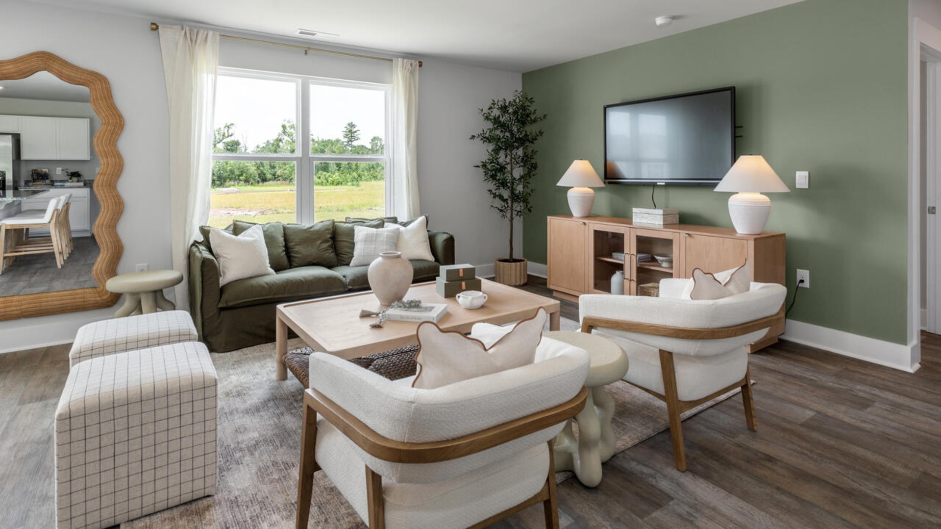 The open-concept kitchen features granite countertops and stainless steel appliances. The kitchen seamlessly connects to the dining and living areas, creating a great space for entertainment.
