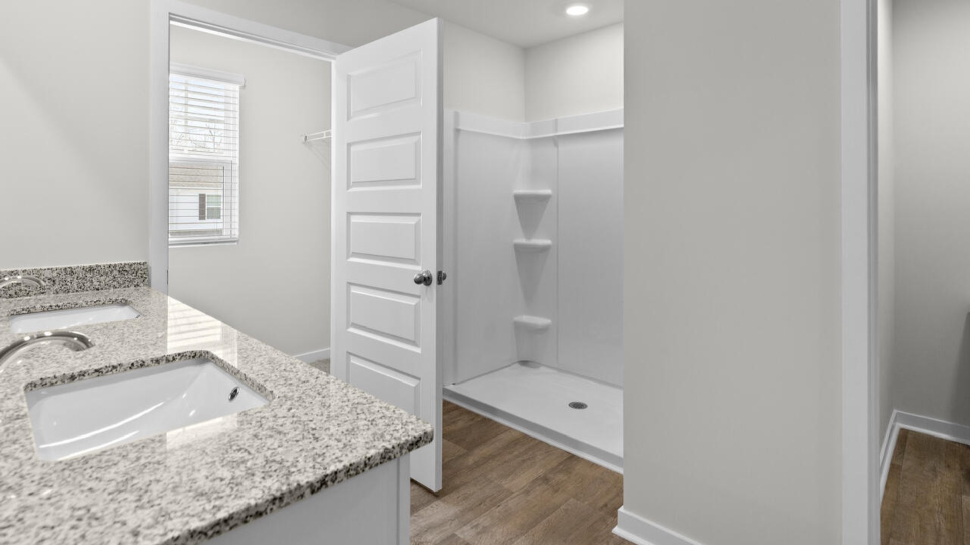 The upstairs has an additional living space, a laundry room, and a Primary Bedroom.