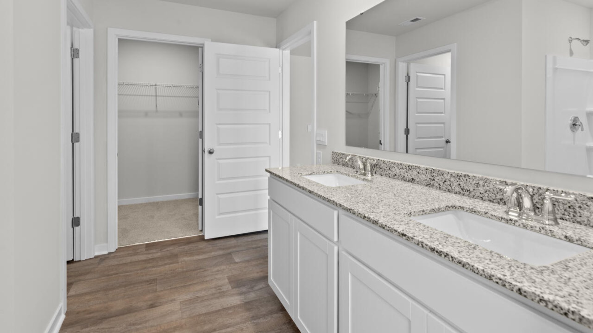 The upstairs has an additional living space, a laundry room, and a Primary Bedroom.
