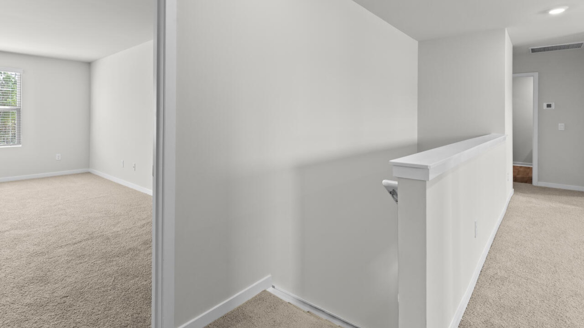 The upstairs has an additional living space, a laundry room, and a Primary Bedroom.