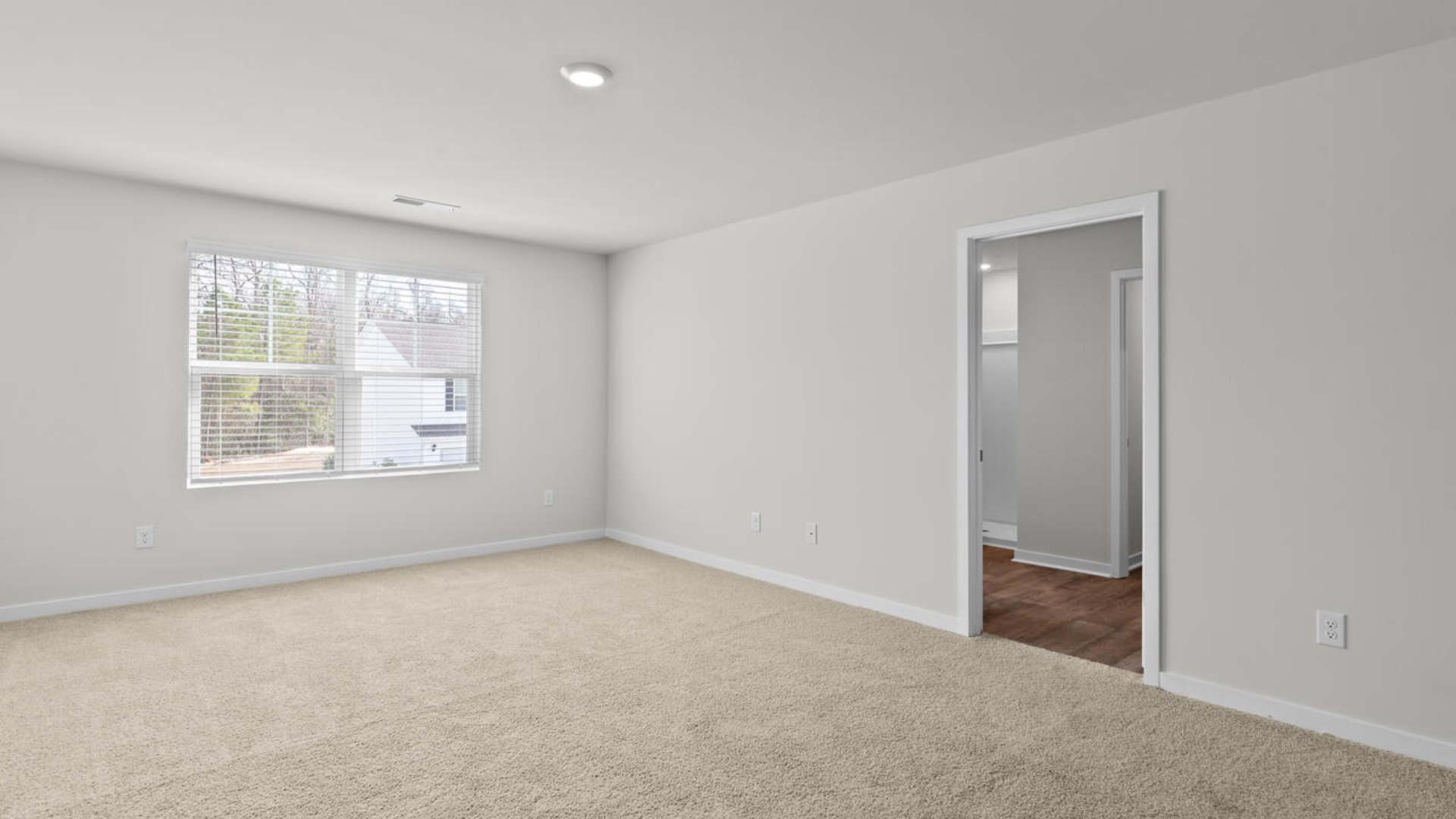 The upstairs has an additional living space, a laundry room, and a Primary Bedroom.