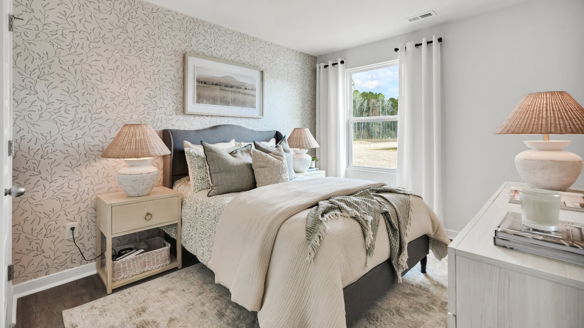 Bedroom One, located at the back of the house for privacy, also has a suite bathroom with double vanity and walk-in closet. Two other bedrooms share a second bathroom. The laundry room is located at the front of home near the two-car garage, quietly away from living areas and bedrooms. Small covered porch at the front.