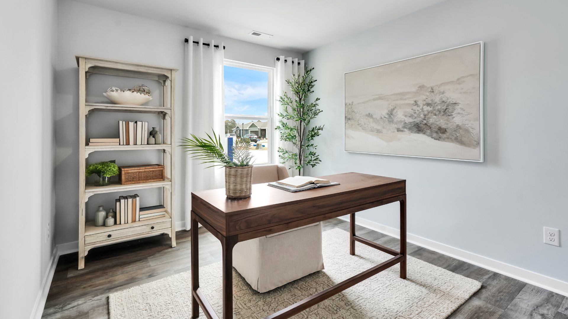 Bedroom One, located at the back of the house for privacy, also has a suite bathroom with double vanity and walk-in closet. Two other bedrooms share a second bathroom. The laundry room is located at the front of home near the two-car garage, quietly away from living areas and bedrooms. Small covered porch at the front.