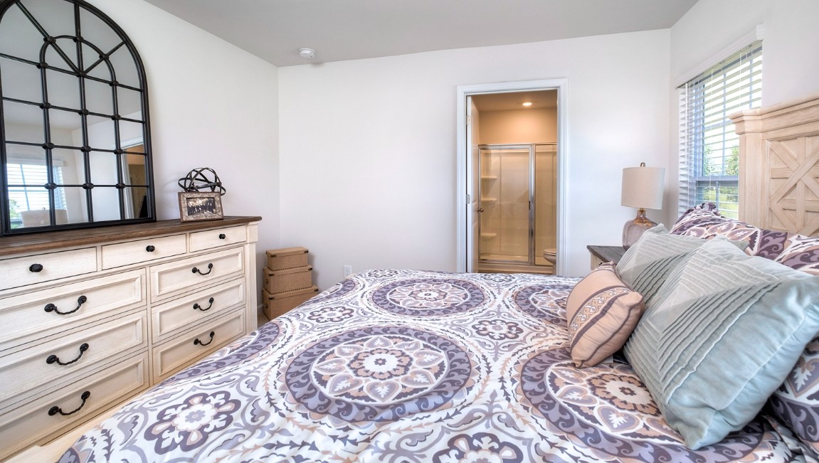 The primary bedroom has its own attached bathroom that features a walk-in closet and all the space you need to get ready in the morning.