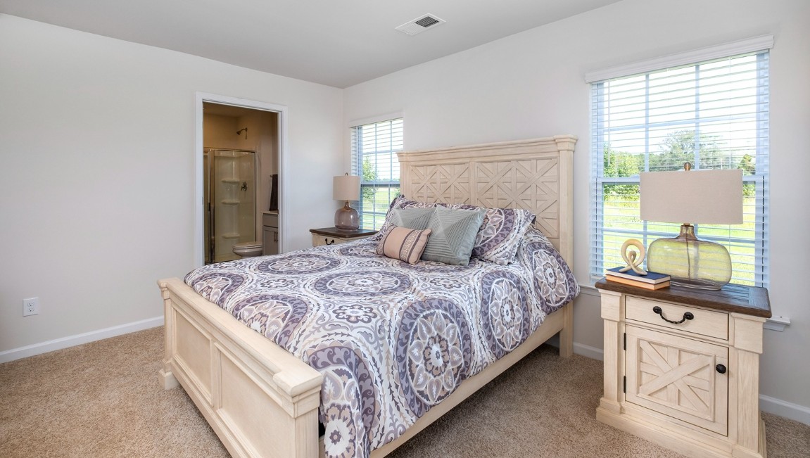 The primary bedroom has its own attached bathroom that features a walk-in closet and all the space you need to get ready in the morning.