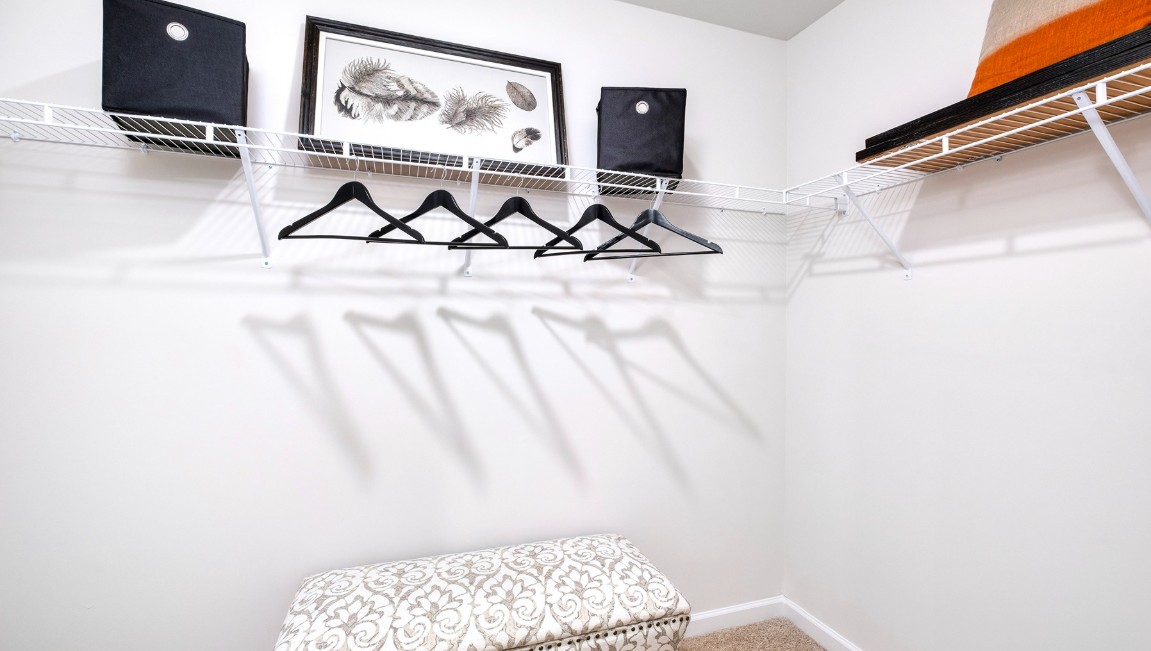 The laundry room is located at the front of home near the two-car garage