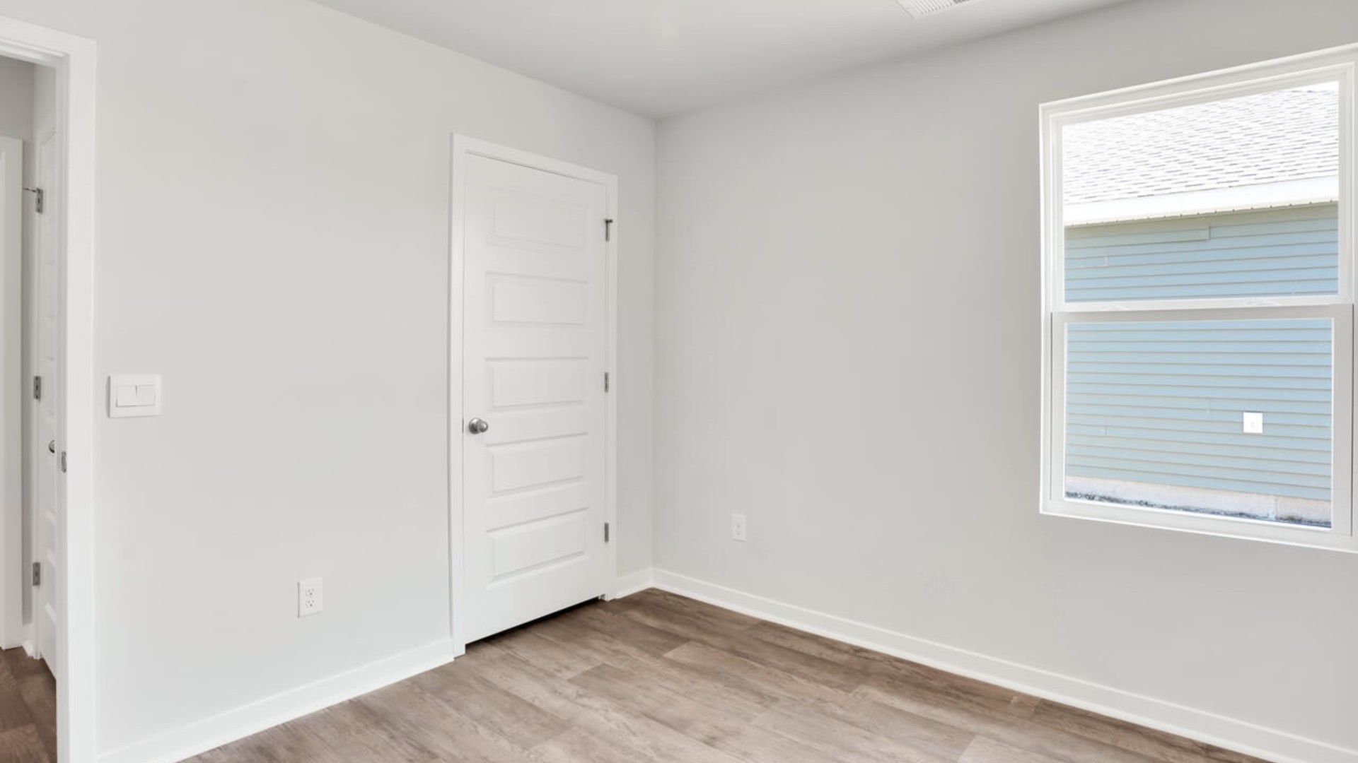 There are two additional bedrooms and bath. Each bedroom has vinyl flooring along with a closet that are versatile to fit your family's needs, whether they become bedrooms or home offices.
