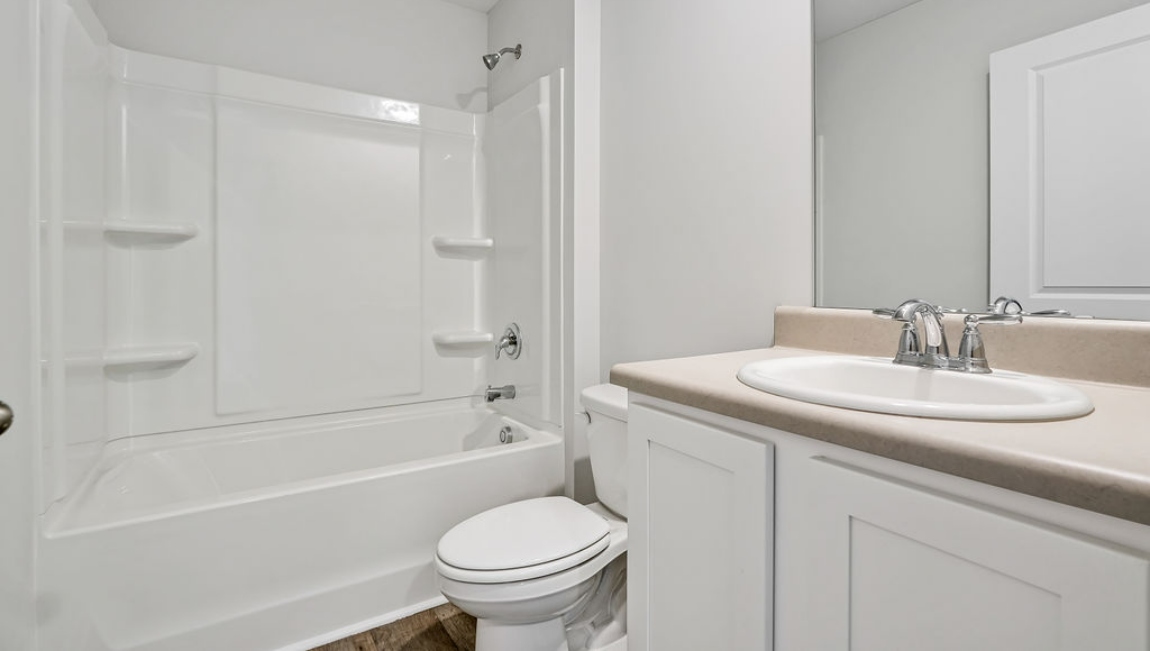 The primary bedroom features an ensuite bathroom with a double vanity, granite countertops, and walk-in closet . Each bedroom has carpeted floors along with a closet that are versatile to fit your family's needs, whether they become bedrooms or home offices.