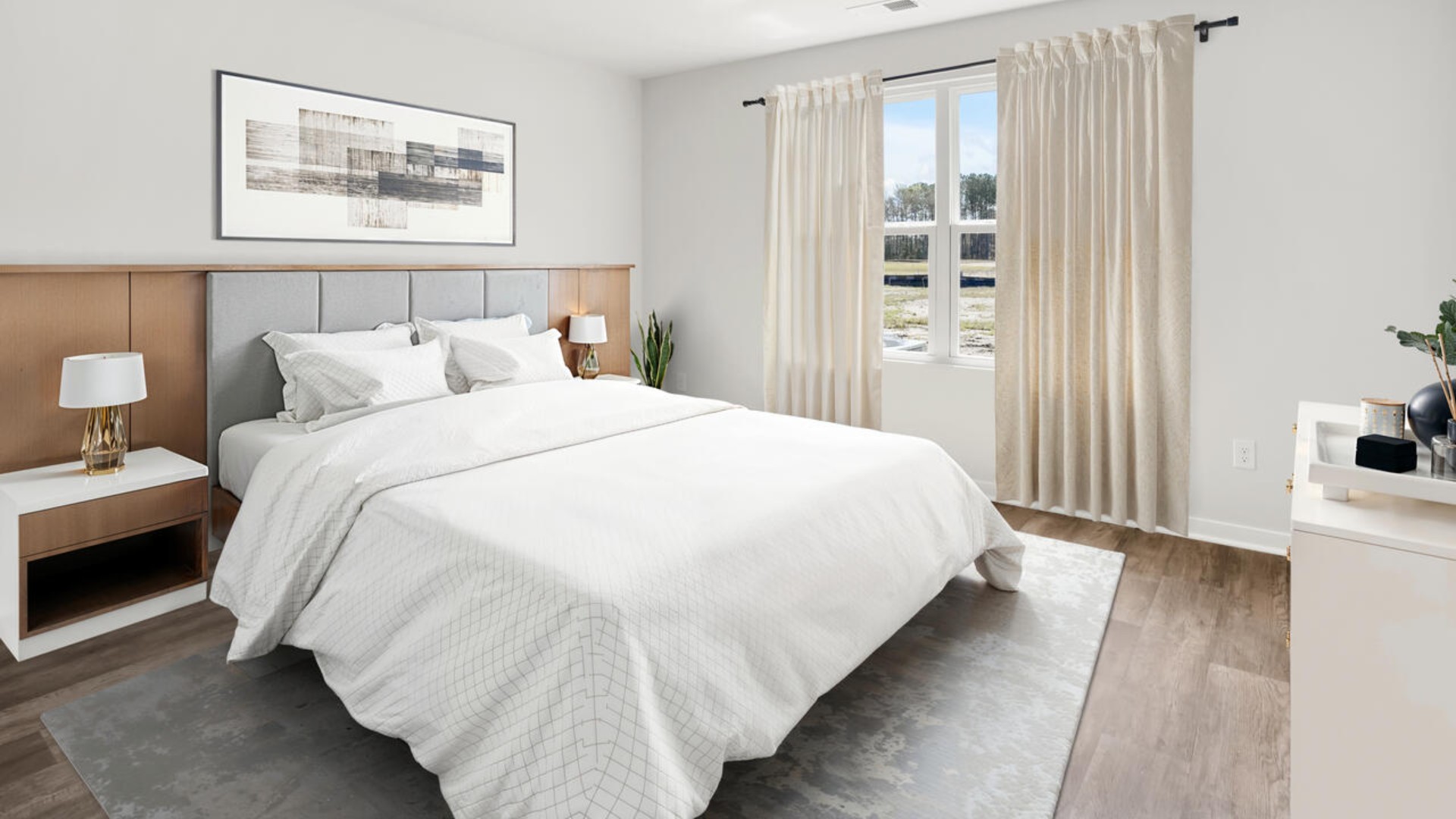 The primary bedroom features an ensuite bathroom with a double vanity, granite countertops, and walk-in closet . Each bedroom has vinyl flooring along with a closet that are versatile to fit your family's needs, whether they become bedrooms or home offices