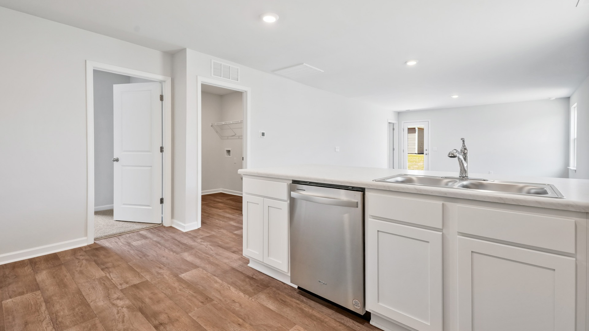 The kitchen features shaker-style cabinets, granite countertops, and stainless-steel appliances, which are sure to both turn heads and make meal prep easy.