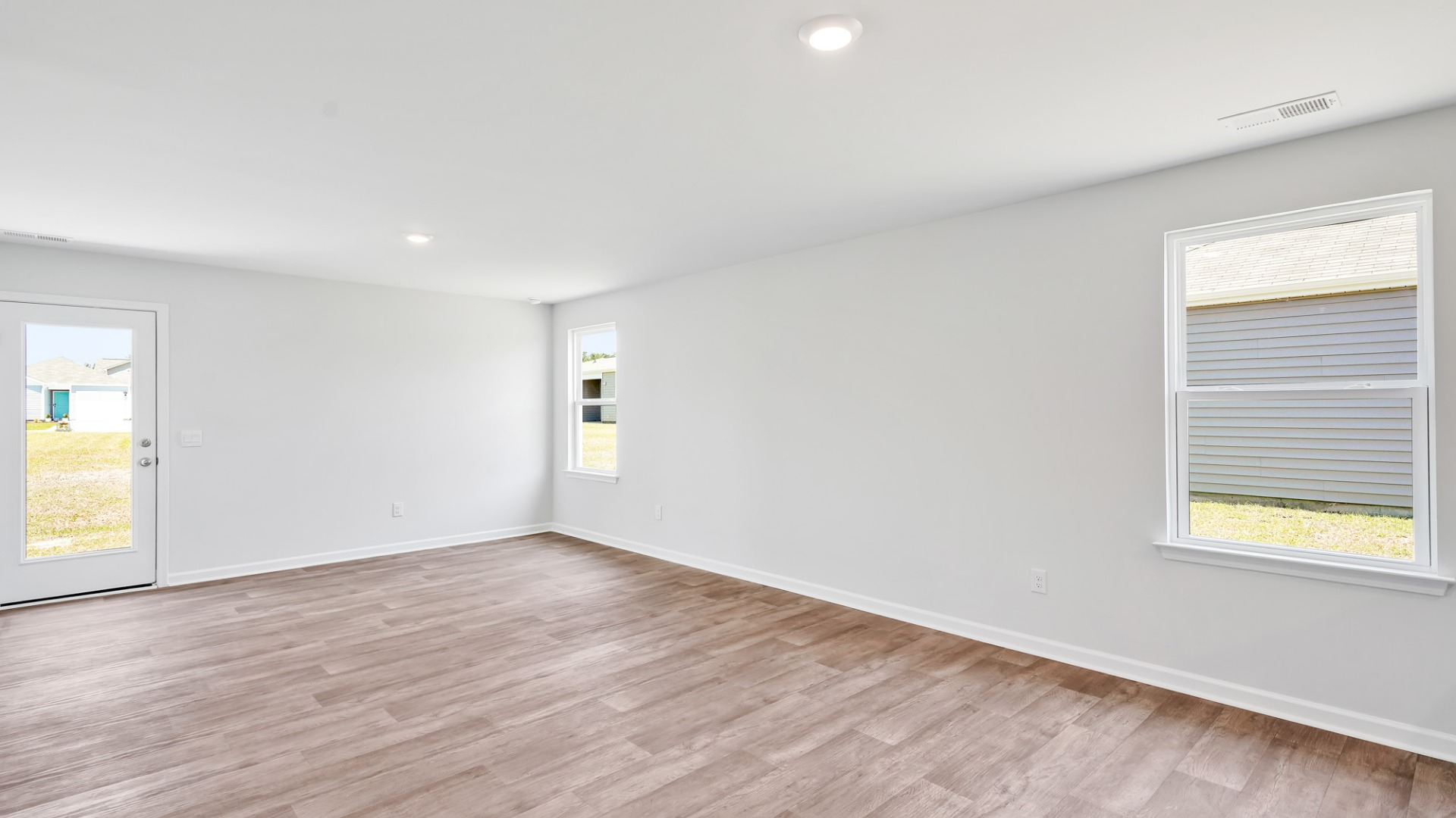 Its open floor design seamlessly integrates the kitchen, dining, and living areas, promoting a sense of spaciousness and connectivity.