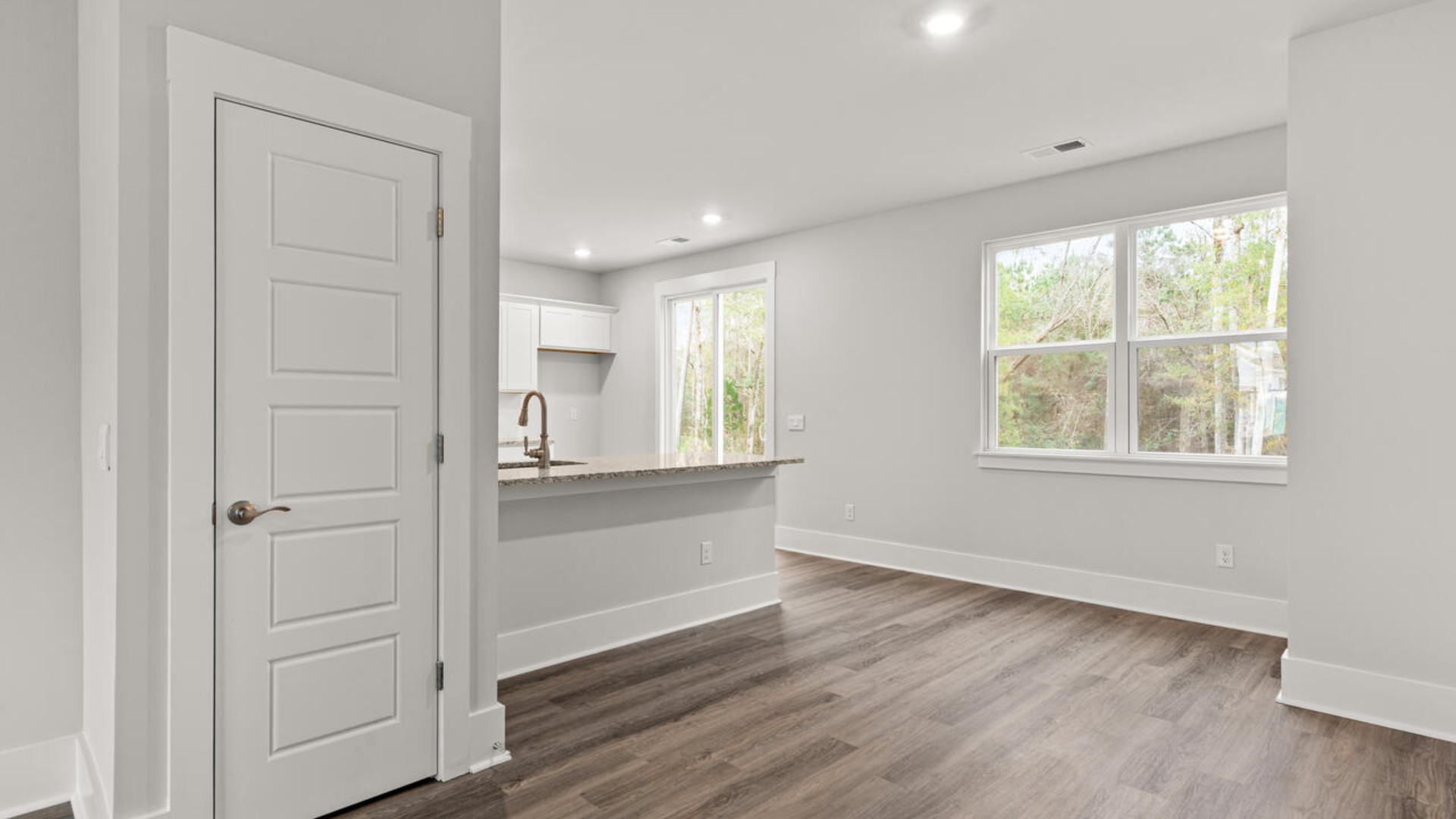 Entering the home we find a large family room and dining area that's perfect for entertaining. The heart of the home is the kitchen features granite counters, stainless-steel appliances and a large peninsula island with room for 4 counter height barstools.