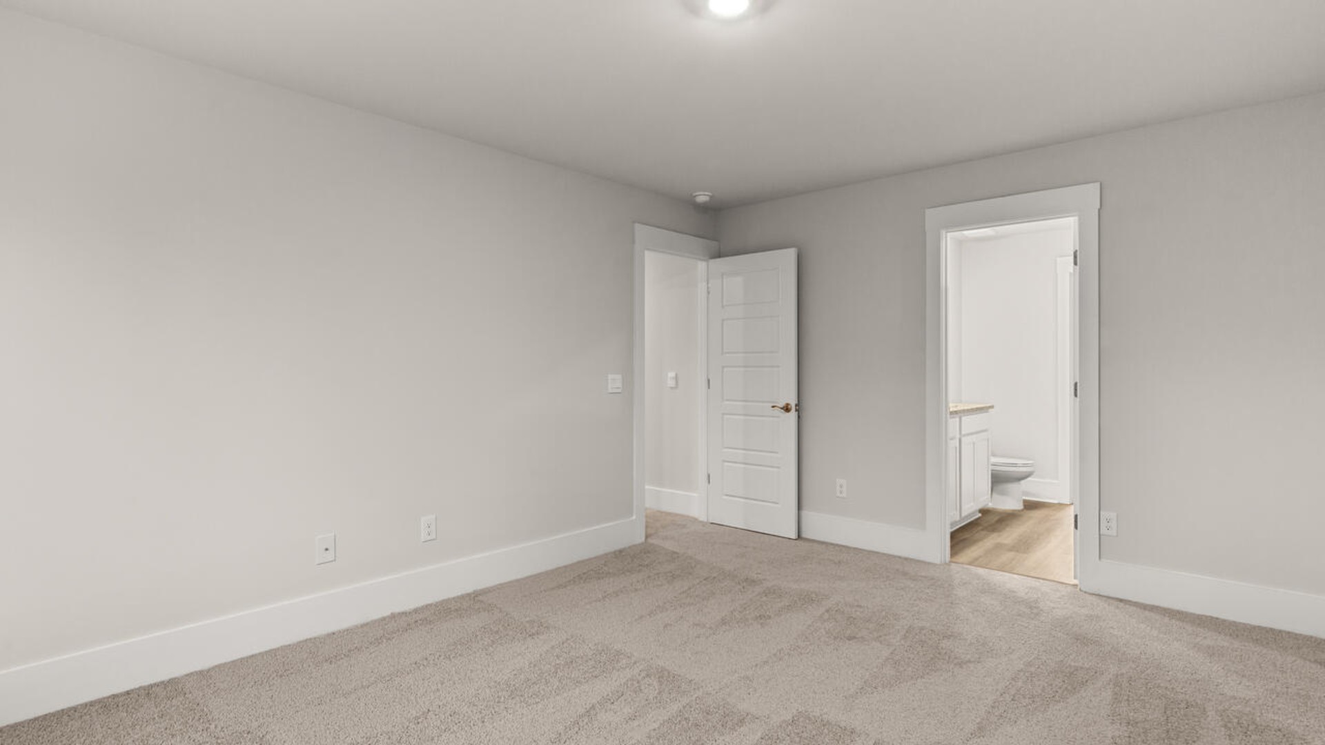 The primary bedroom has its own attached bathroom that features a walk-in closet and all the space you need to get ready in the morning.