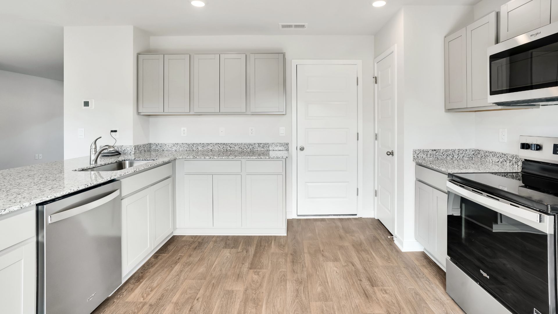 Entering the home we find a large family room and dining area that's perfect for entertaining. The heart of the home is the kitchen features granite counters, stainless-steel appliances and a large peninsula island with room for 4 counter height barstools.