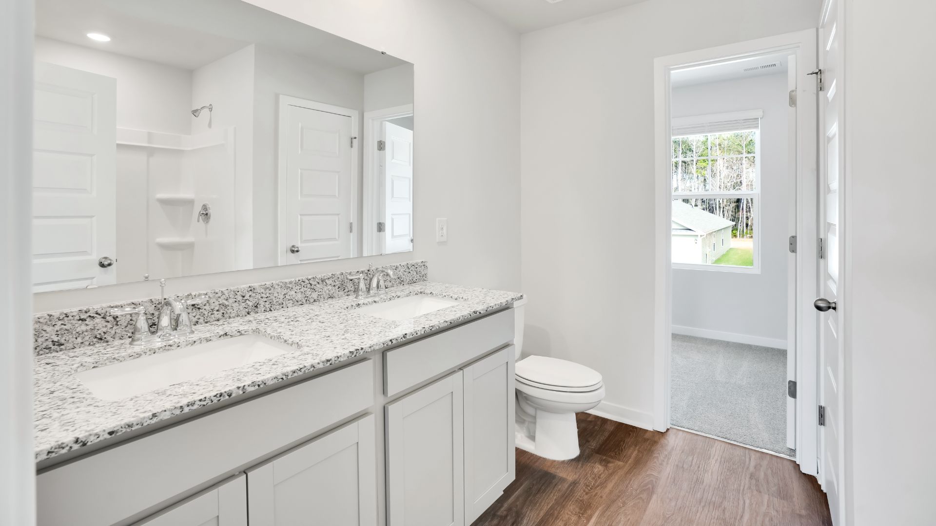 The primary bedroom has its own attached bathroom that features a walk-in closet and all the space you need to get ready in the morning.