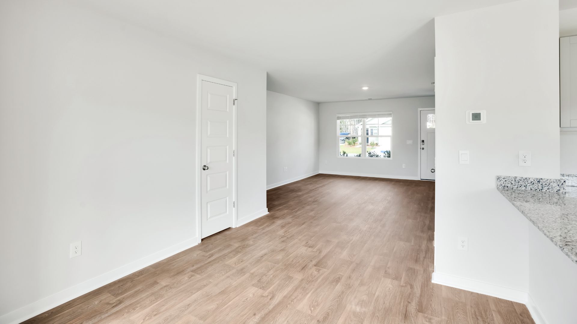 Entering the home we find a large family room and dining area that's perfect for entertaining. The heart of the home is the kitchen features granite counters, stainless-steel appliances and a large peninsula island with room for 4 counter height barstools.