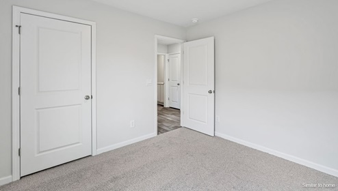 The primary bedroom features an ensuite bathroom with a double vanity, granite countertops, and walk-in closet . Each bedroom has carpeted floors along with a closet that are versatile to fit your family's needs, whether they become bedrooms or home offices.