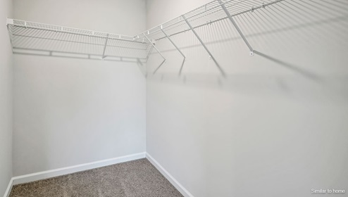 The primary bedroom features an ensuite bathroom with a double vanity, granite countertops, and walk-in closet . Each bedroom has carpeted floors along with a closet that are versatile to fit your family's needs, whether they become bedrooms or home offices.
