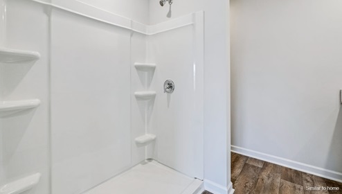 The primary bedroom features an ensuite bathroom with a double vanity, granite countertops, and walk-in closet . Each bedroom has carpeted floors along with a closet that are versatile to fit your family's needs, whether they become bedrooms or home offices.