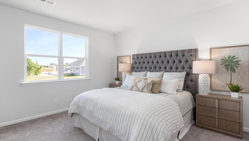 The primary bedroom features an ensuite bathroom with a double vanity, granite countertops, and walk-in closet . Each bedroom has carpeted floors along with a closet that are versatile to fit your family's needs, whether they become bedrooms or home offices.