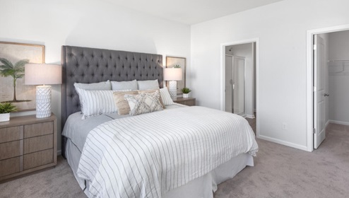 The primary bedroom features an ensuite bathroom with a double vanity, granite countertops, and walk-in closet . Each bedroom has carpeted floors along with a closet that are versatile to fit your family's needs, whether they become bedrooms or home offices.