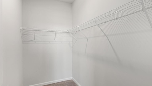 The primary bedroom features an ensuite bathroom with a double vanity, granite countertops, and walk-in closet . Each bedroom has carpeted floors along with a closet that are versatile to fit your family's needs, whether they become bedrooms or home offices.