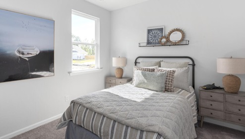 The primary bedroom features an ensuite bathroom with a double vanity, granite countertops, and walk-in closet . Each bedroom has carpeted floors along with a closet that are versatile to fit your family's needs, whether they become bedrooms or home offices.