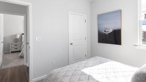 The primary bedroom features an ensuite bathroom with a double vanity, granite countertops, and walk-in closet . Each bedroom has carpeted floors along with a closet that are versatile to fit your family's needs, whether they become bedrooms or home offices.