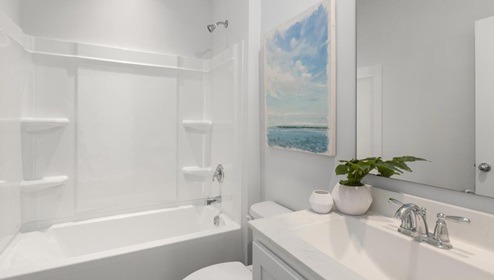 The primary bedroom features an ensuite bathroom with a double vanity, granite countertops, and walk-in closet . Each bedroom has carpeted floors along with a closet that are versatile to fit your family's needs, whether they become bedrooms or home offices.