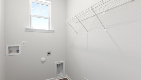 The primary bedroom features an ensuite bathroom with a double vanity, granite countertops, and walk-in closet . Each bedroom has carpeted floors along with a closet that are versatile to fit your family's needs, whether they become bedrooms or home offices.