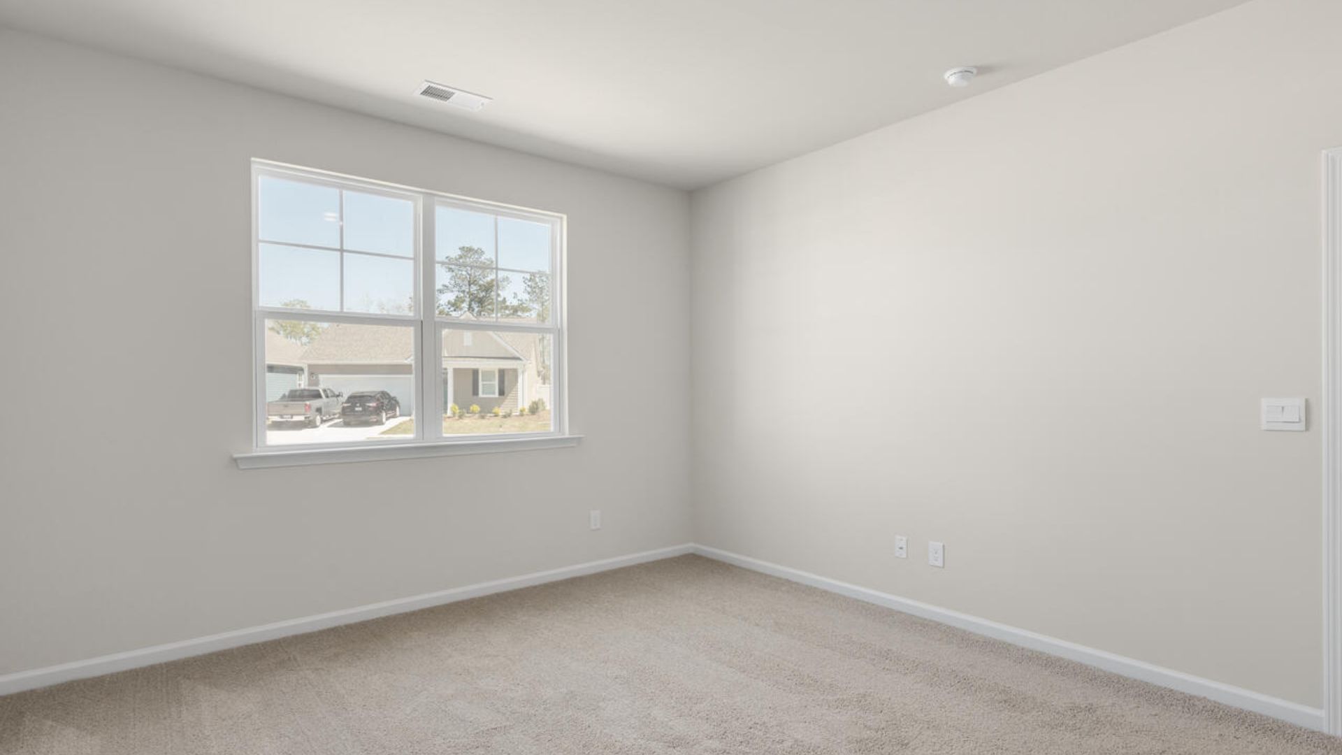 At the back, the Primary Suite provides privacy with a large walk-in closet and walk-in shower. This floor plan combines comfort and convenience, making it a great choice for those seeking an open layout and a 2-car garage.