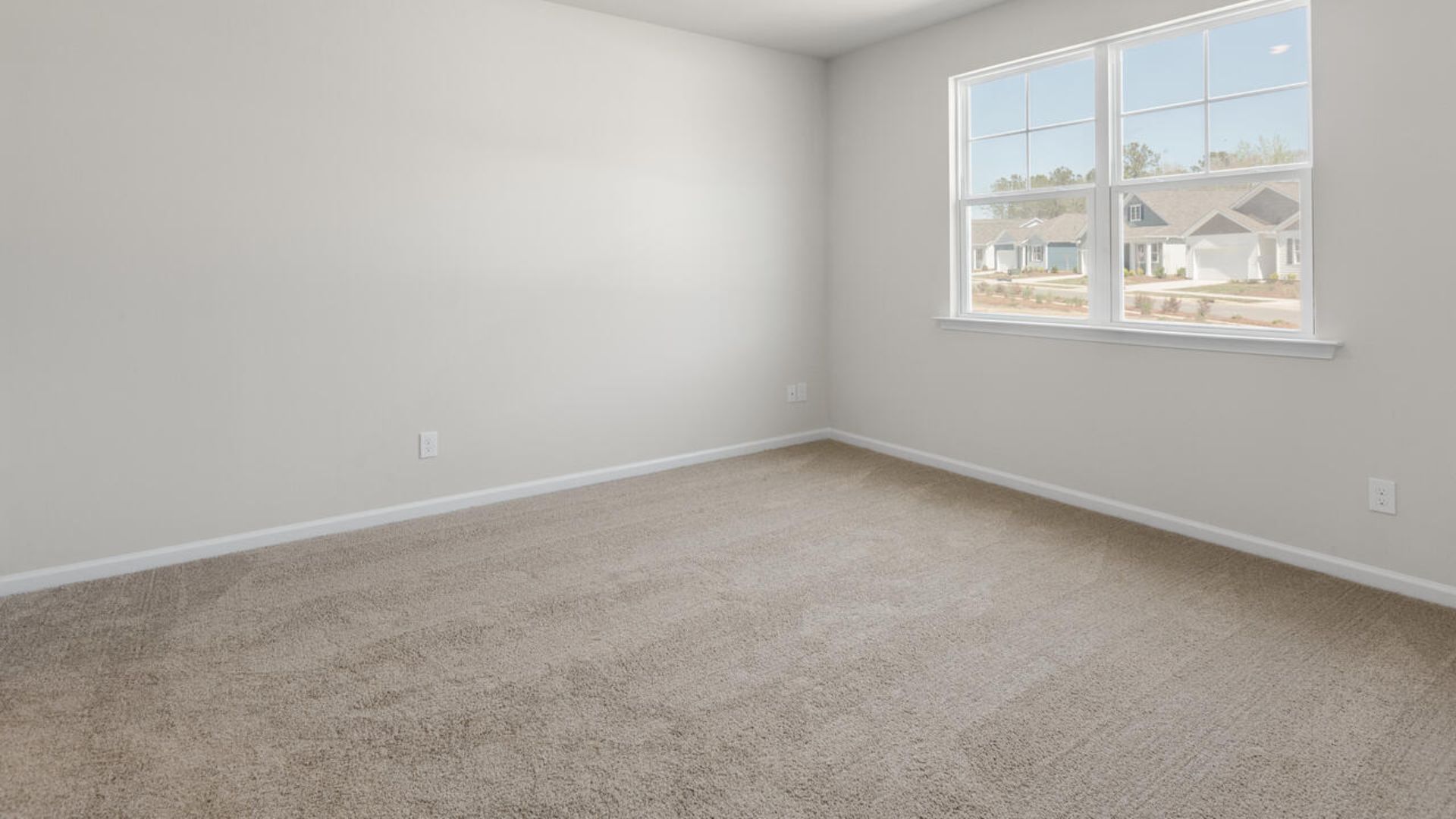 At the back, the Primary Suite provides privacy with a large walk-in closet and walk-in shower. This floor plan combines comfort and convenience, making it a great choice for those seeking an open layout and a 2-car garage.