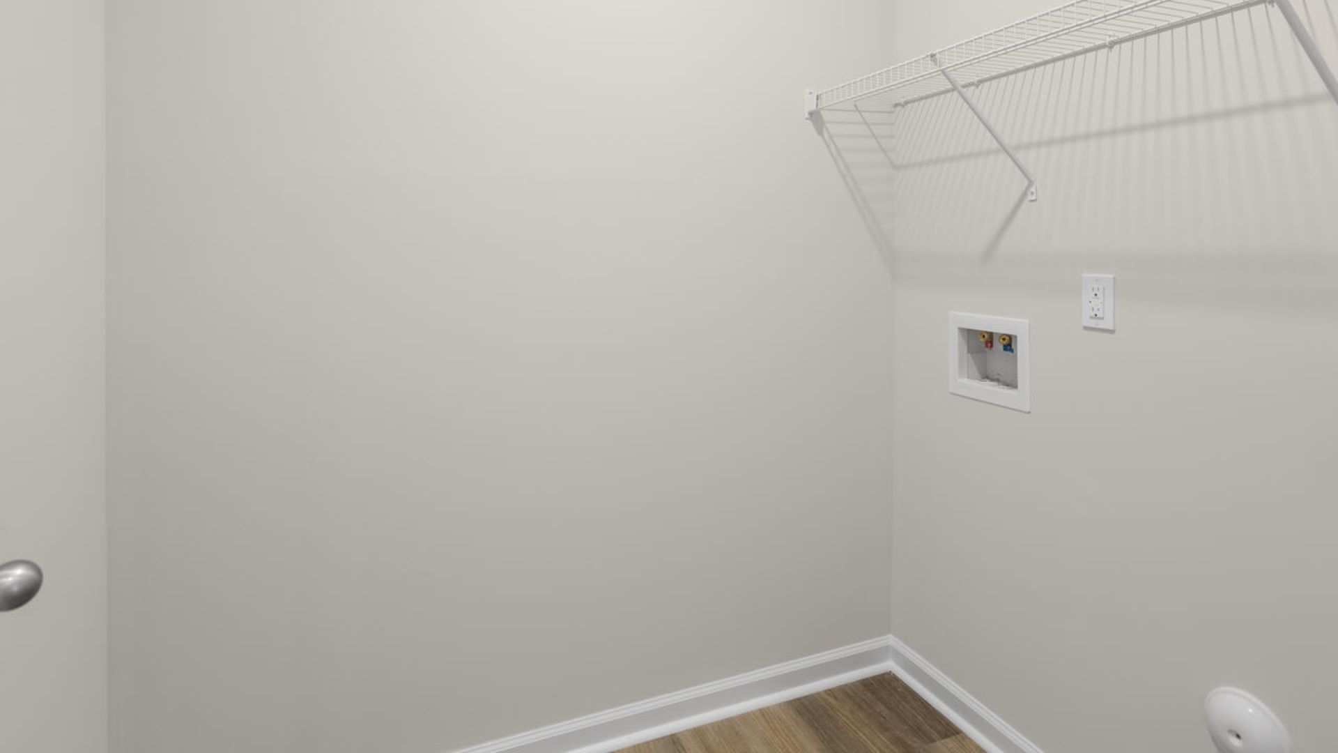 At the back, the Primary Suite provides privacy with a large walk-in closet and walk-in shower. This floor plan combines comfort and convenience, making it a great choice for those seeking an open layout and a 2-car garage.