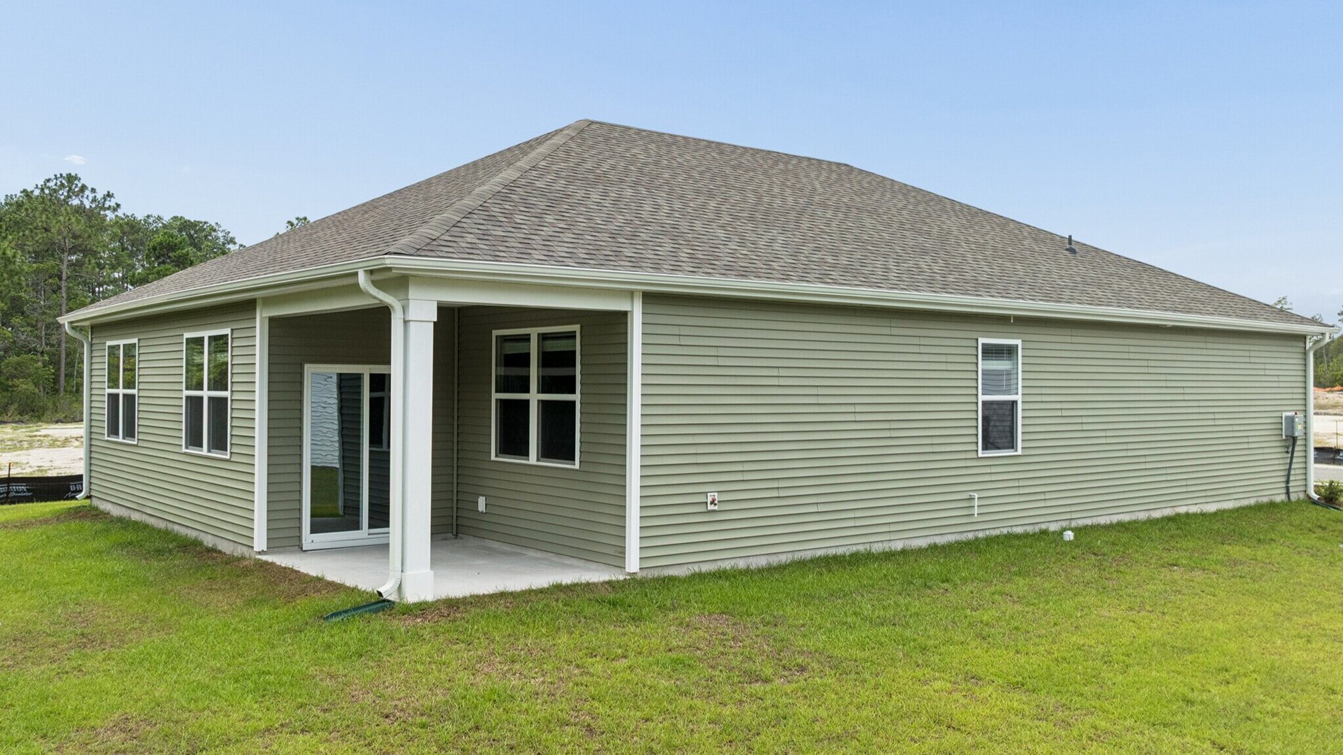 Enjoy the covered porch perfect for entertaining and enjoying the Carolina evenings. With its open layout and sleek design, the Aria is ideal for anyone seeking comfort and modern features.