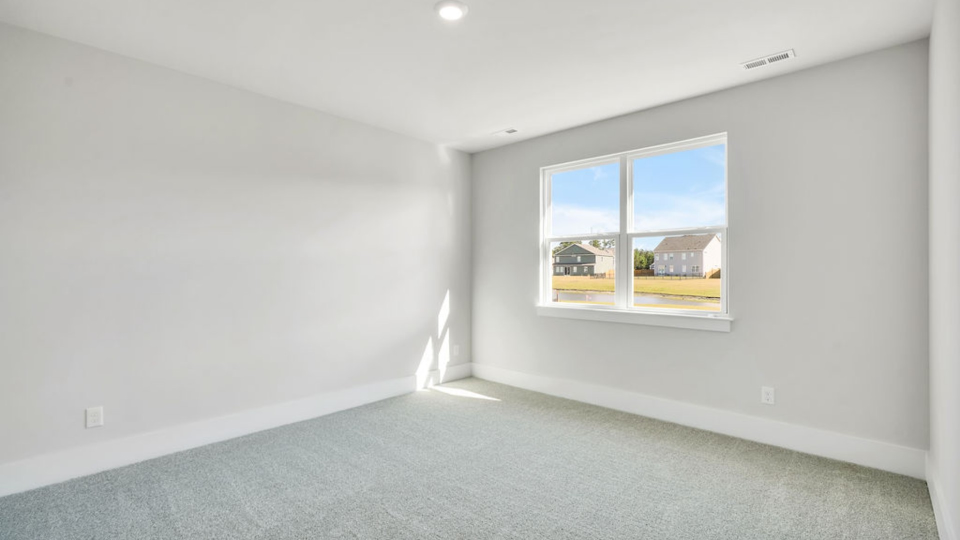 The Primary Suite offers a massive closet and a luxurious bathroom with a walk-in shower, linen closet, and dual vanity