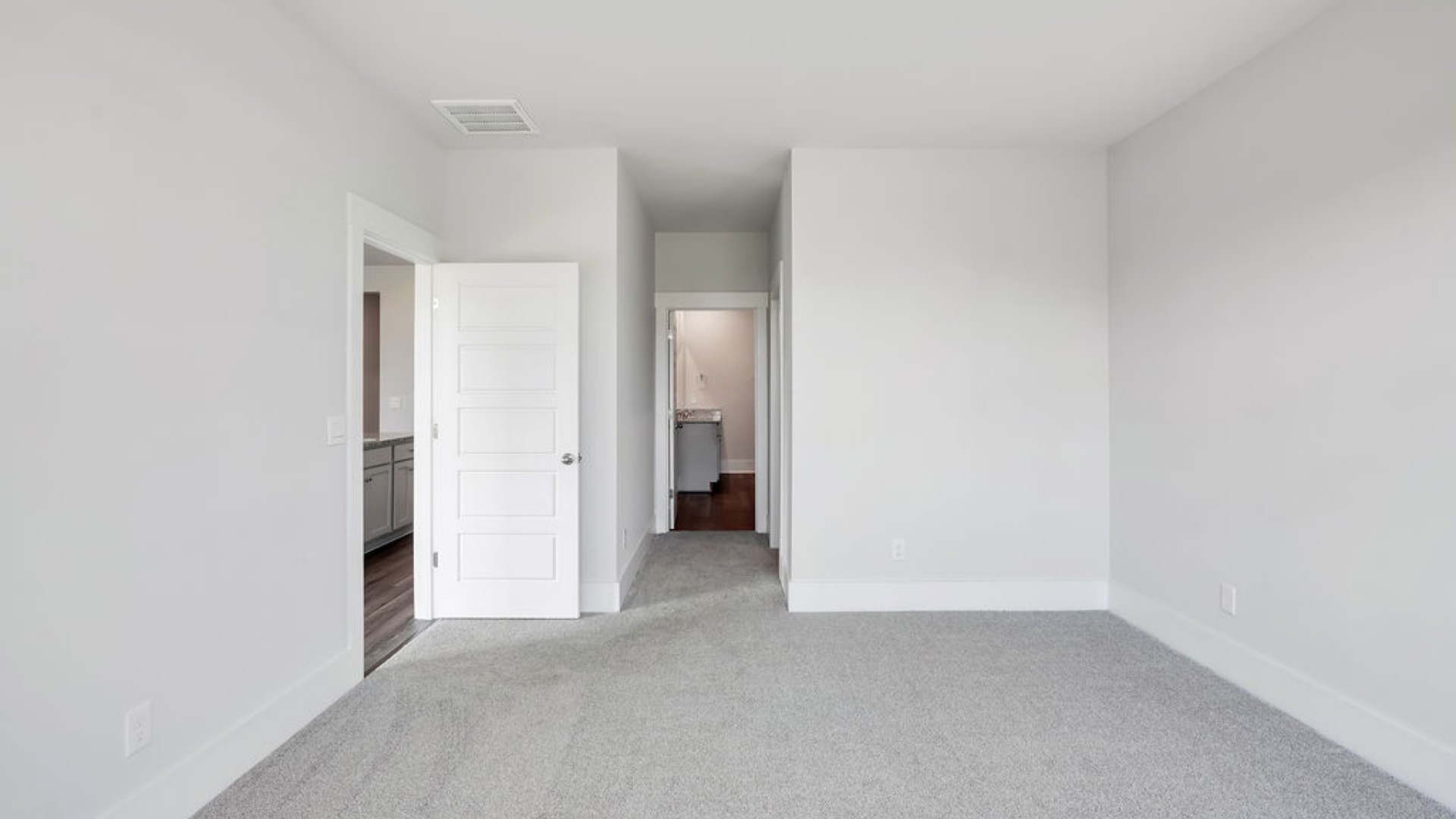 The Primary Suite offers a massive closet and a luxurious bathroom with a walk-in shower, linen closet, and dual vanity