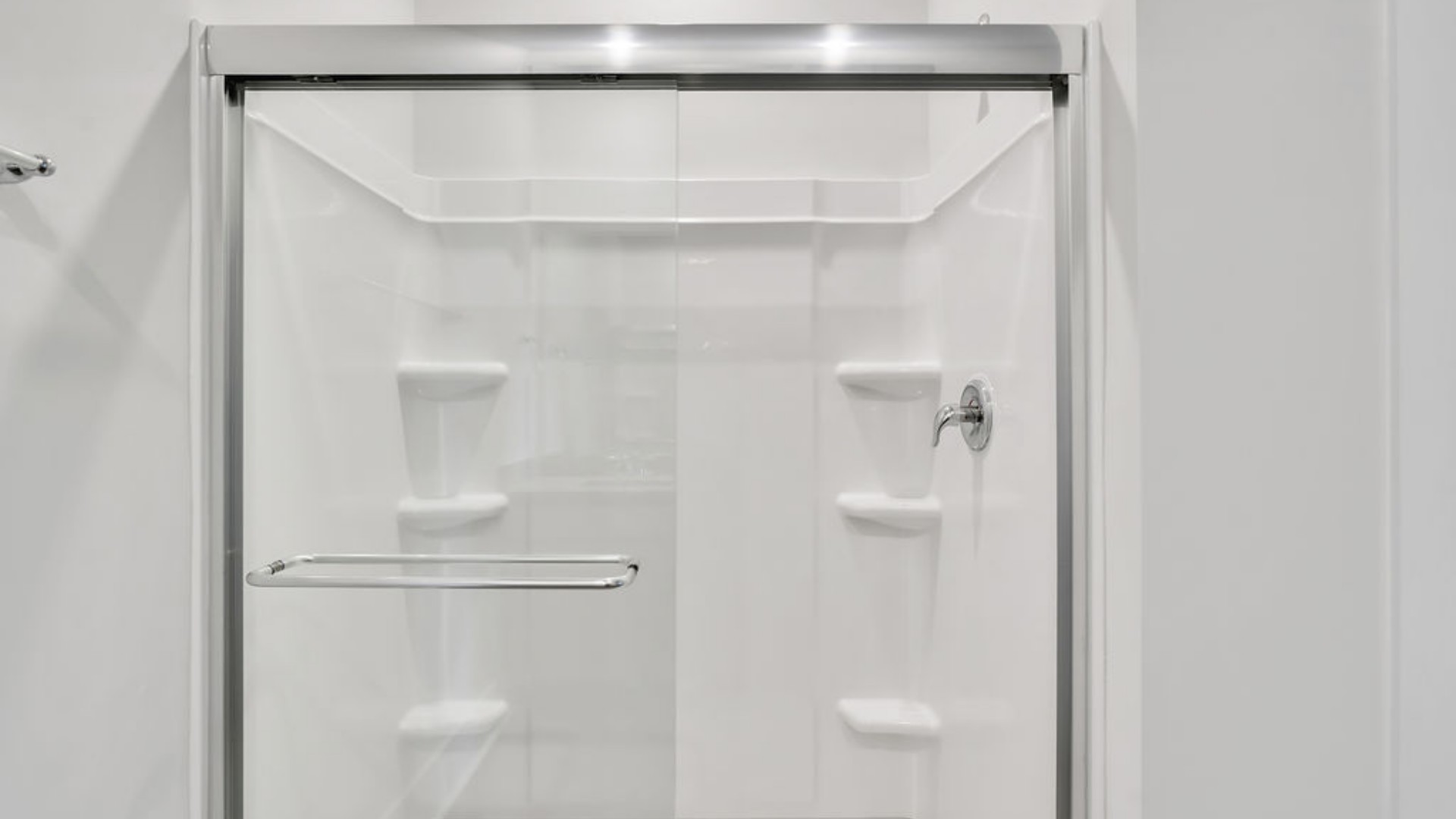 The Primary Suite offers a massive closet and a luxurious bathroom with a walk-in shower, linen closet, and dual vanity