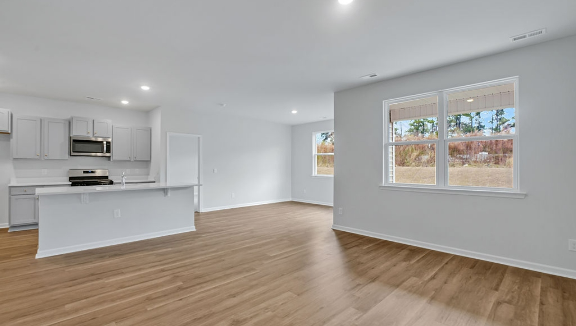 View of kitchen and dining room from living room