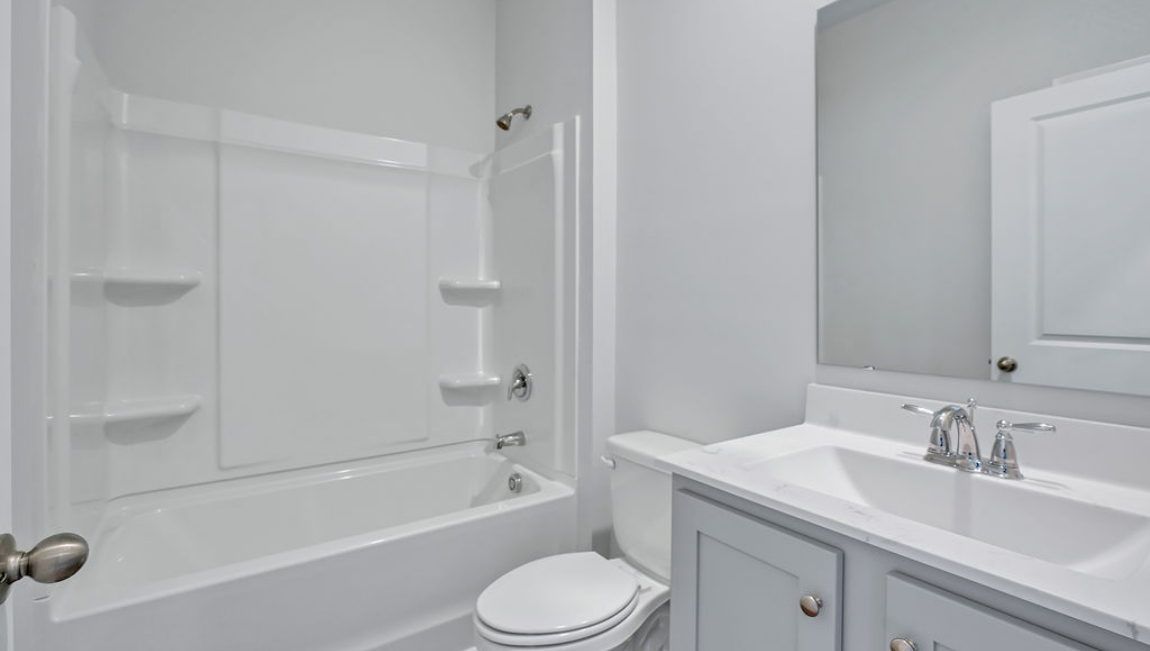 Guest bathroom with tub and shower combo
