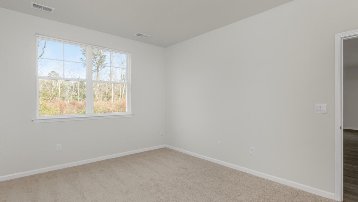 The primary bedroom has its own attached bathroom that features a walk-in closet and all the space you need to get ready in the morning.