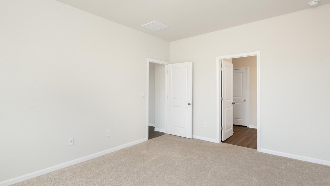 The primary bedroom has its own attached bathroom that features a walk-in closet and all the space you need to get ready in the morning.
