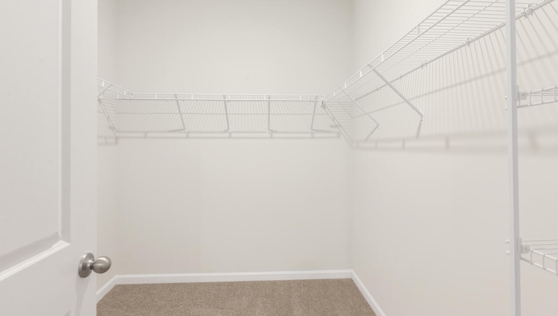 The primary bedroom has its own attached bathroom that features a walk-in closet and all the space you need to get ready in the morning.