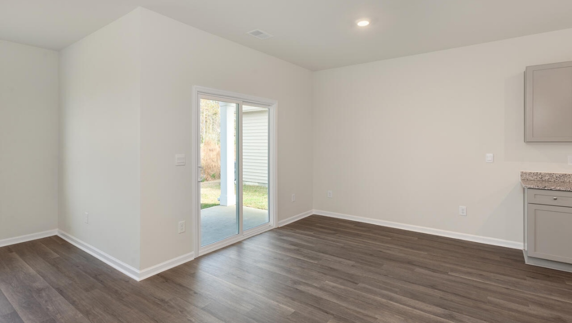 The kitchen features beautiful cabinets, granite countertops, and stainless steel appliances, which are sure to both turn heads and make meal prep easy. You’ll never be too far from the action with the living and dining area right there.